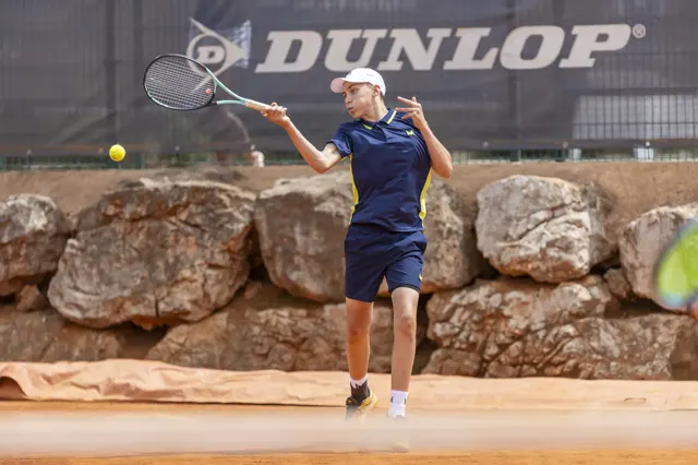 Coach giving forehand advice to a player on court