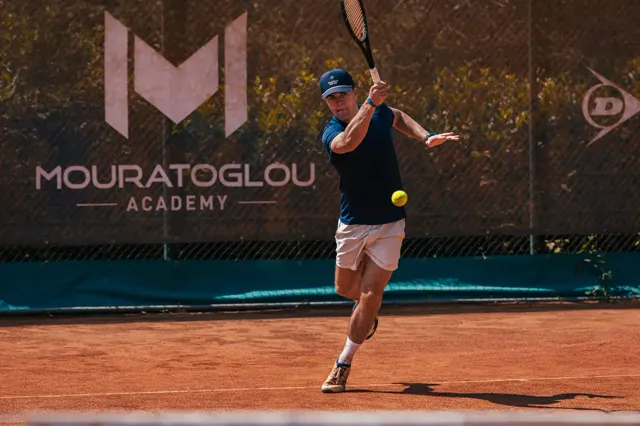 Player running to hit a forehand on a clay court