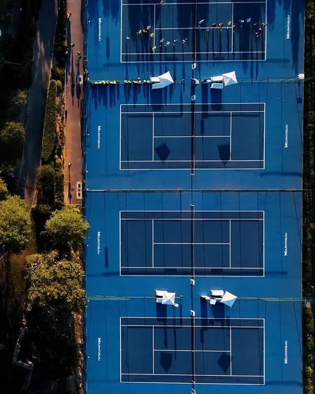 Aerial view of clay and hard tennis courts