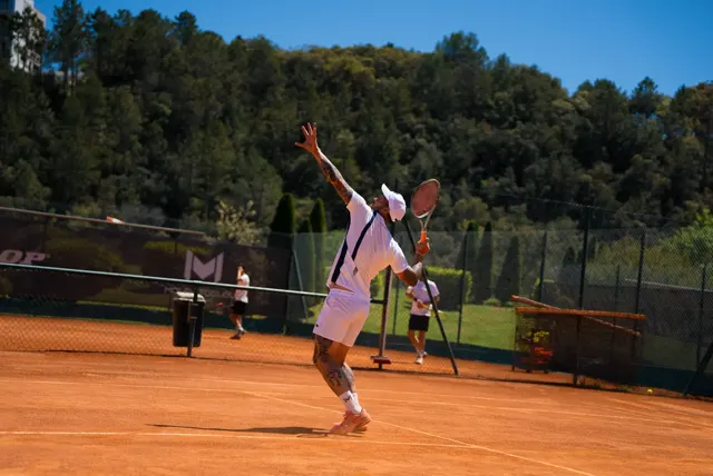 Player in the trophy position on the serve, elbow high