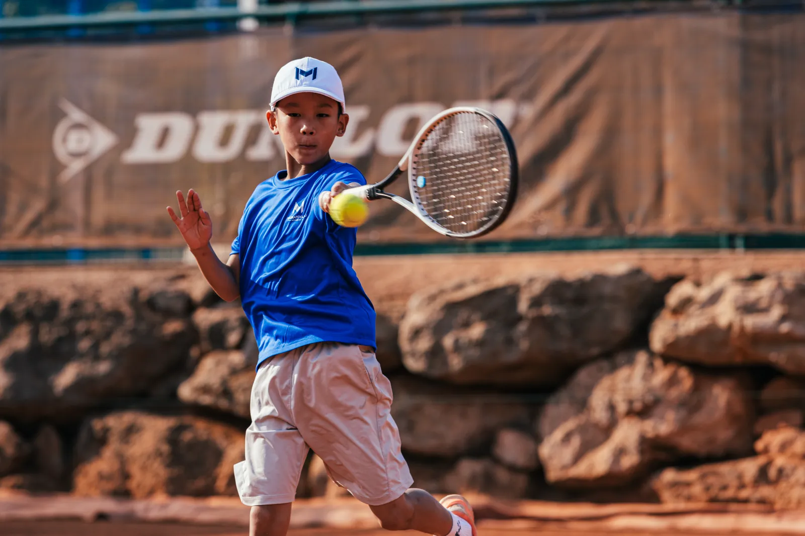Player hitting a flat forehand with arm extended