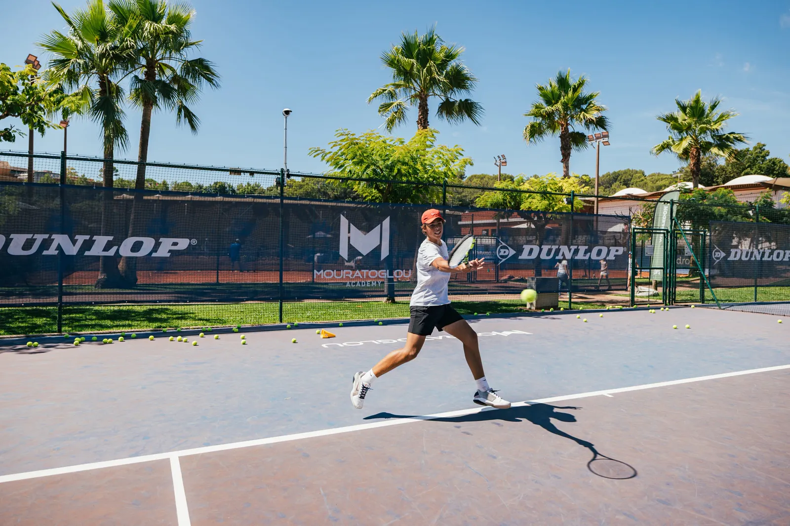 Young player hitting a forehand during training