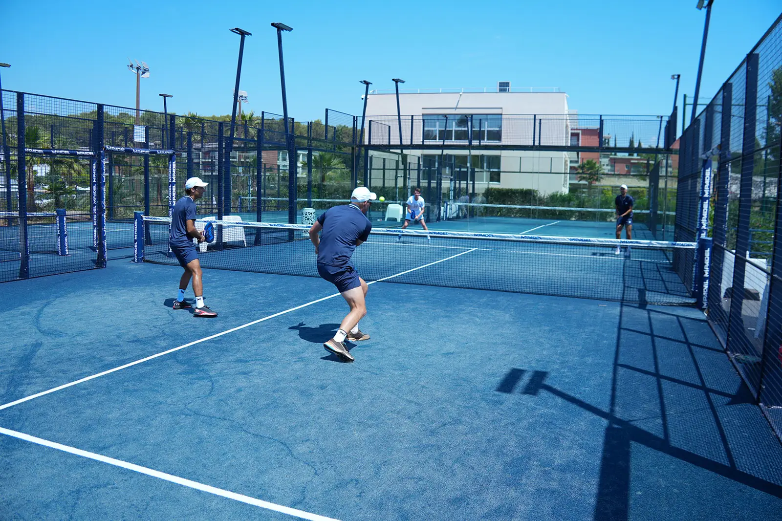 Four players during a group padel lesson in Bodrum