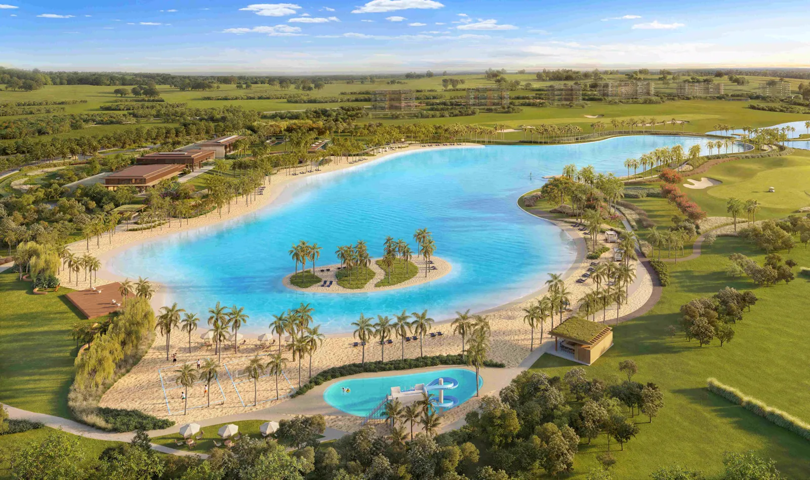 Vista aérea de la futura laguna con su playa de arena y su isla cubierta de palmeras en Heritage Riviera.