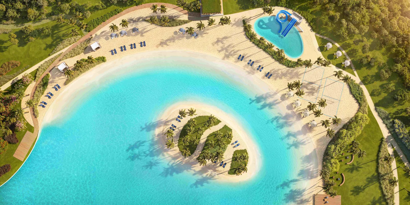 Vista aérea de la isla de la laguna, la playa y la piscina infantil en Heritage Riviera.