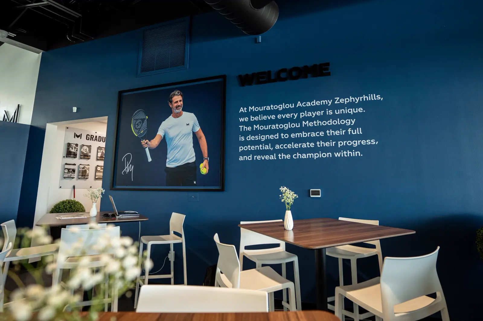 Welcome wall with the Mouratoglou Methodology message in the academy lounge