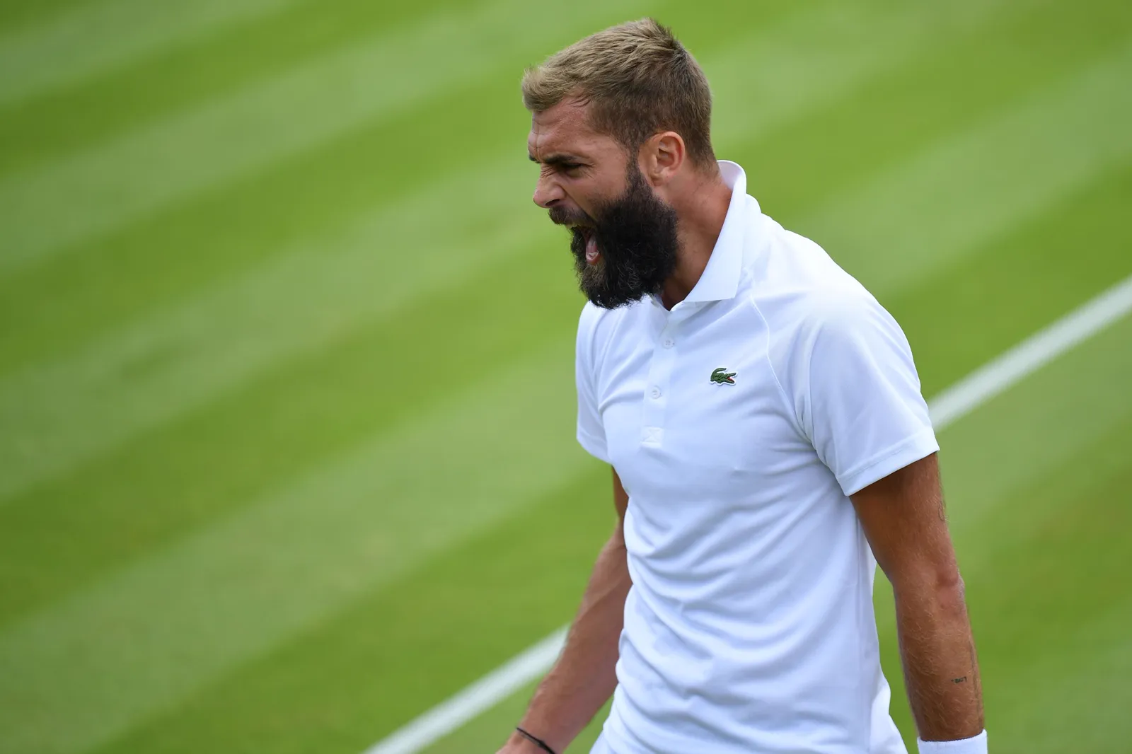 Benoît Paire looking down on a grass court