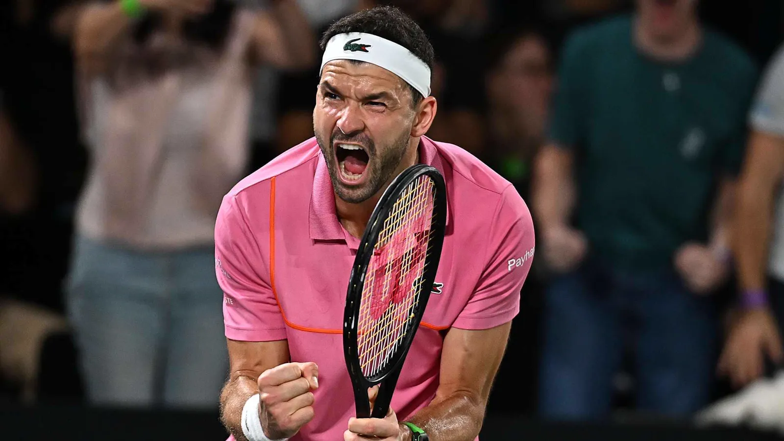Grigor Dimitrov apretando el puño y gritando para celebrar