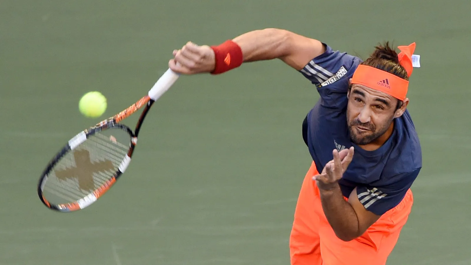 Marcos Baghdatis serving on a hard court