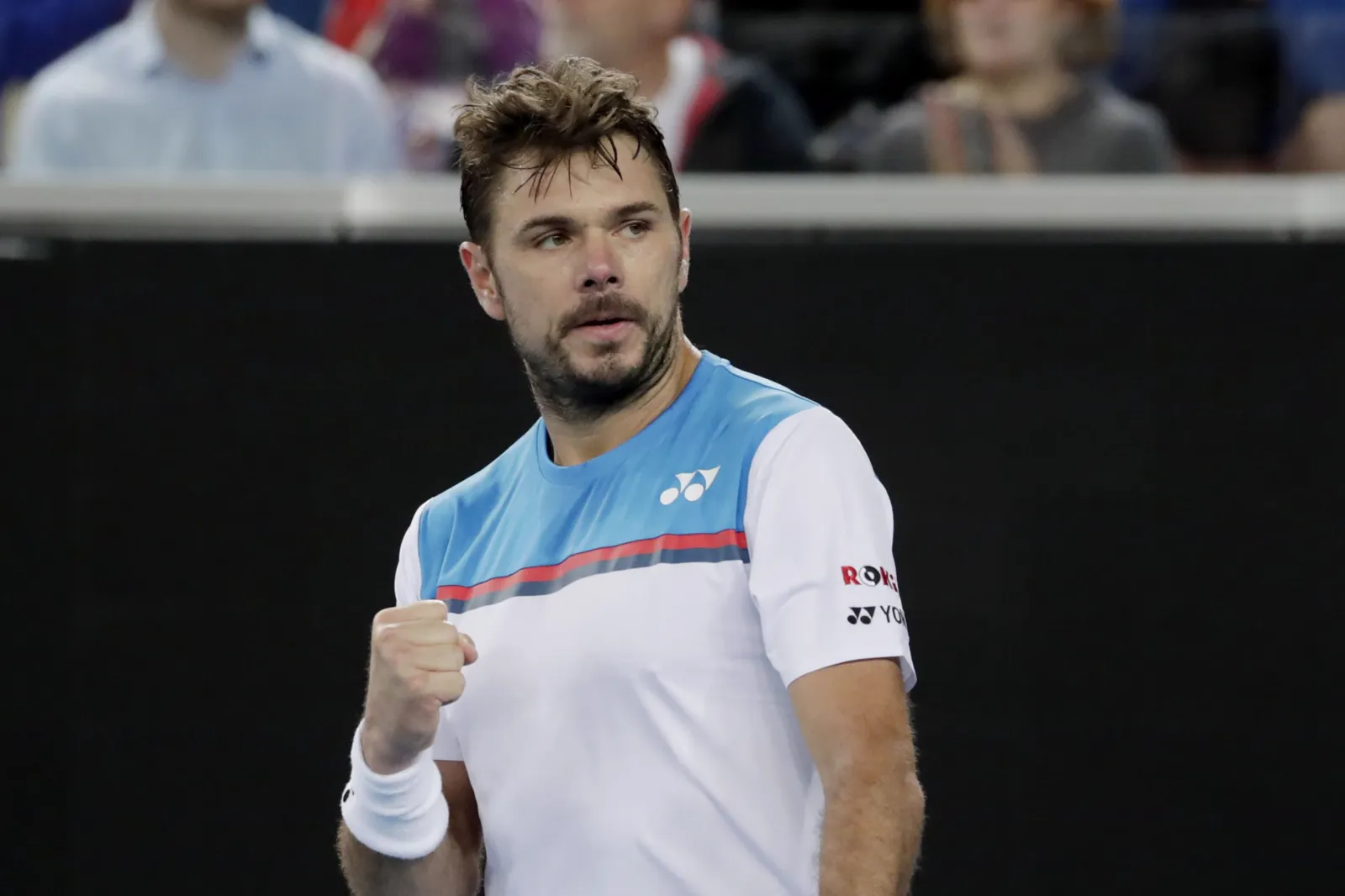 Stan Wawrinka clenching his fist on court